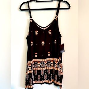 NWT Torrid tank top. Fitted at top and flows at the bottom.